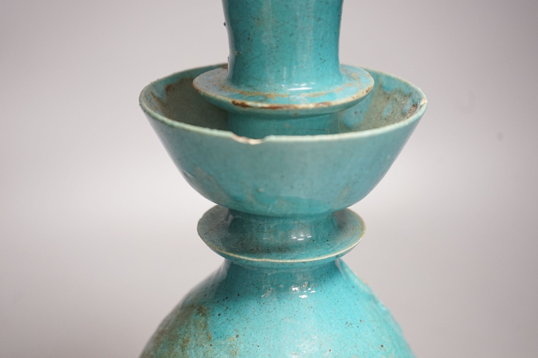 A Persian turquoise glazed huqqa base, 17th century or later, 33cm